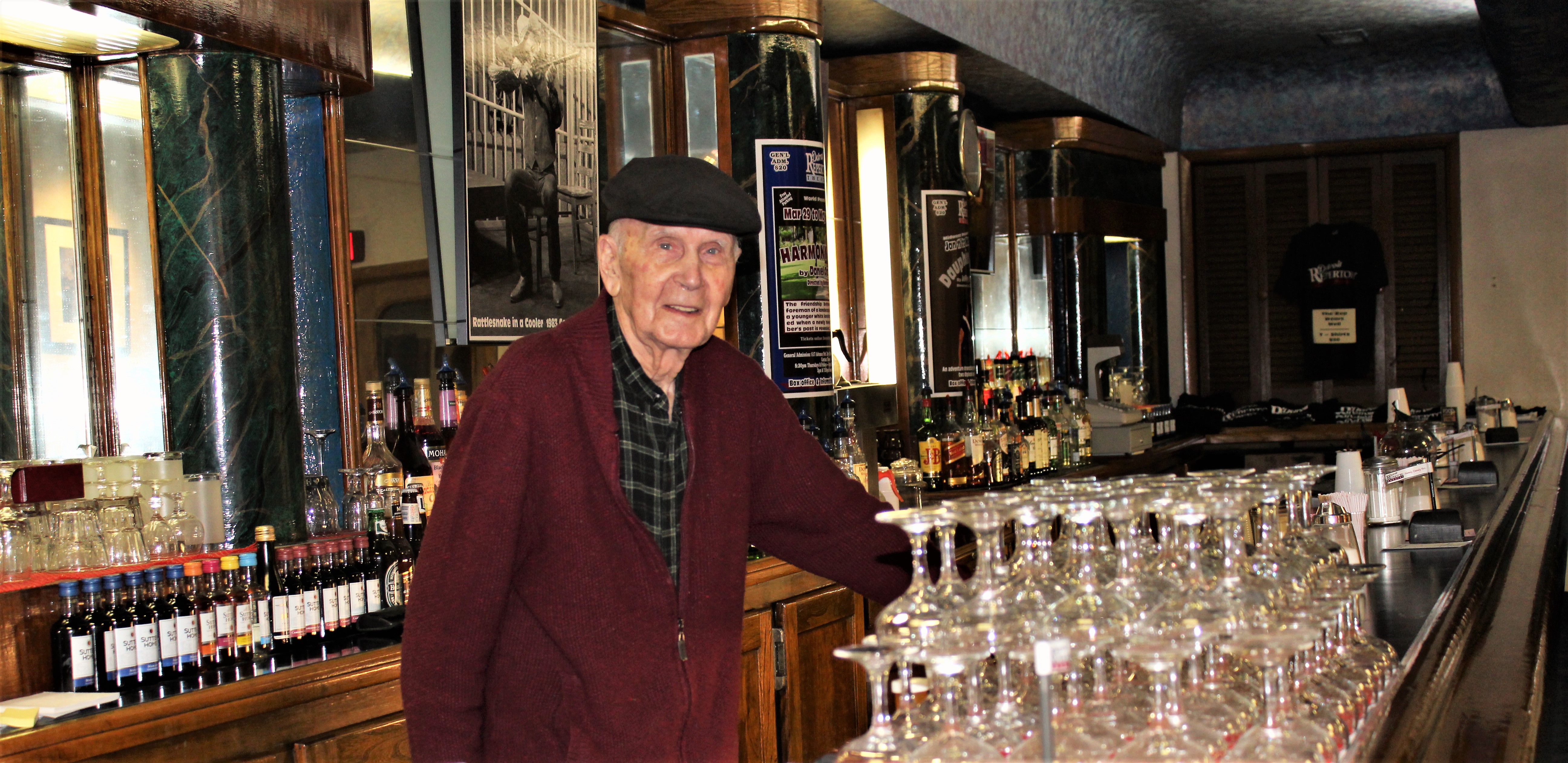 Bruce Millan behind the iconic bar at the Detroit Repertory Theatre photo by sarah williams