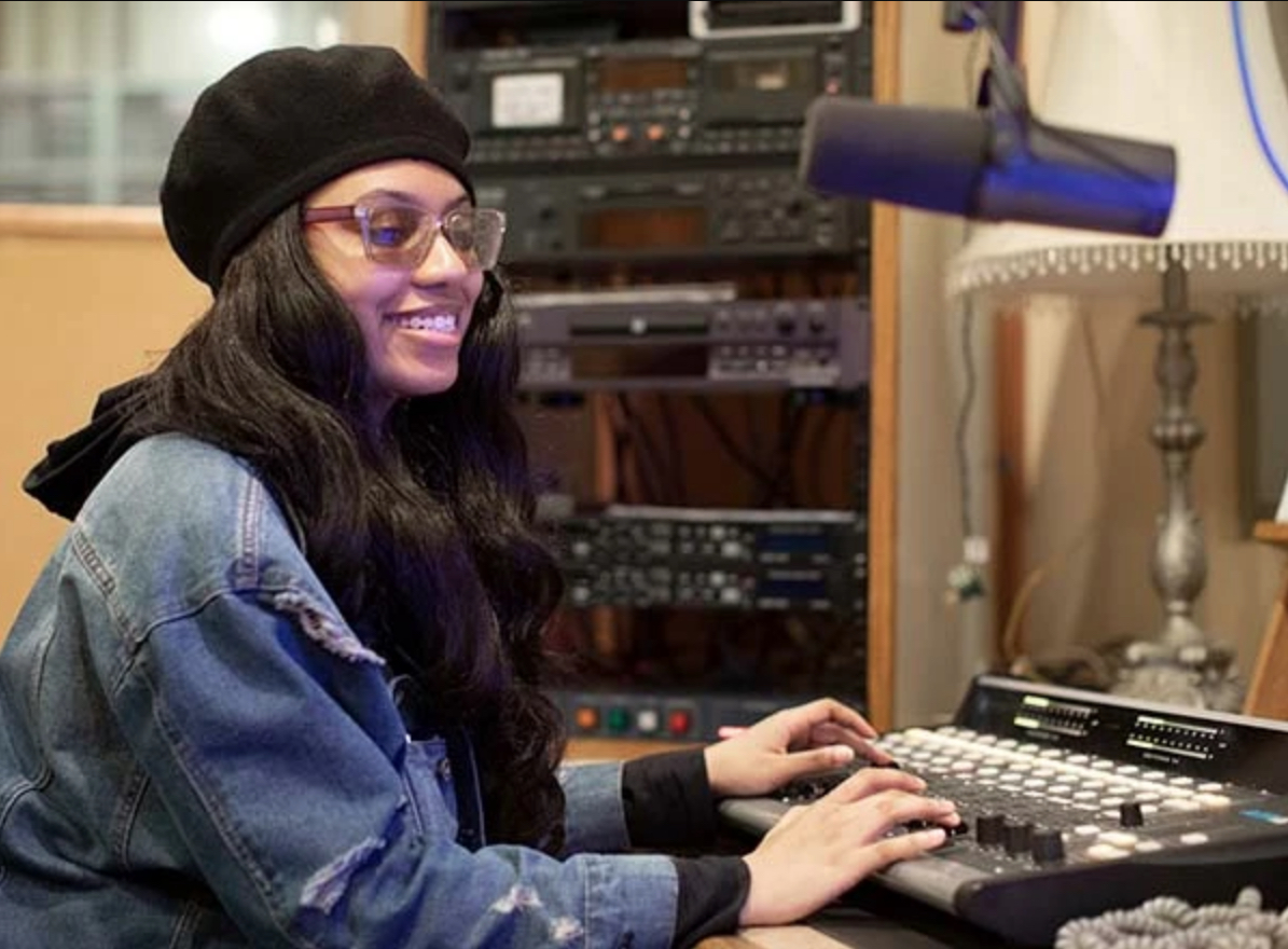 A Henry Ford College student operates the board in the studio at WHFR. Photo courtesy of HFC Marketing