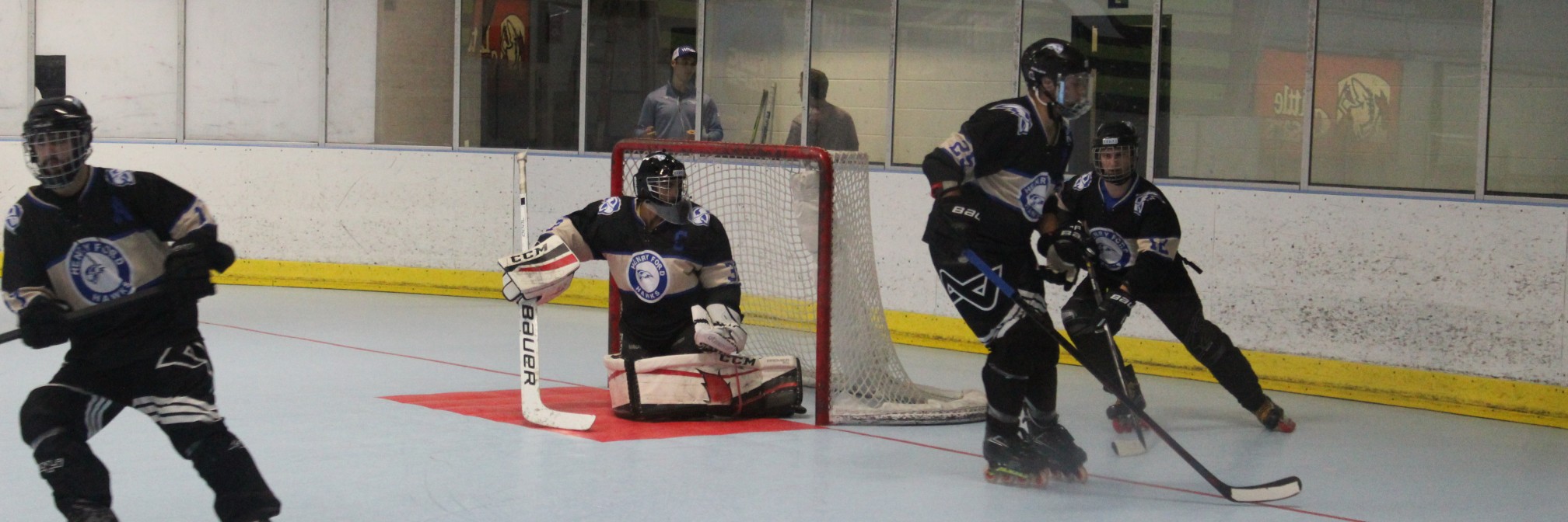 Four Hokey players from HFC Roller Hockey Club playing Hockey