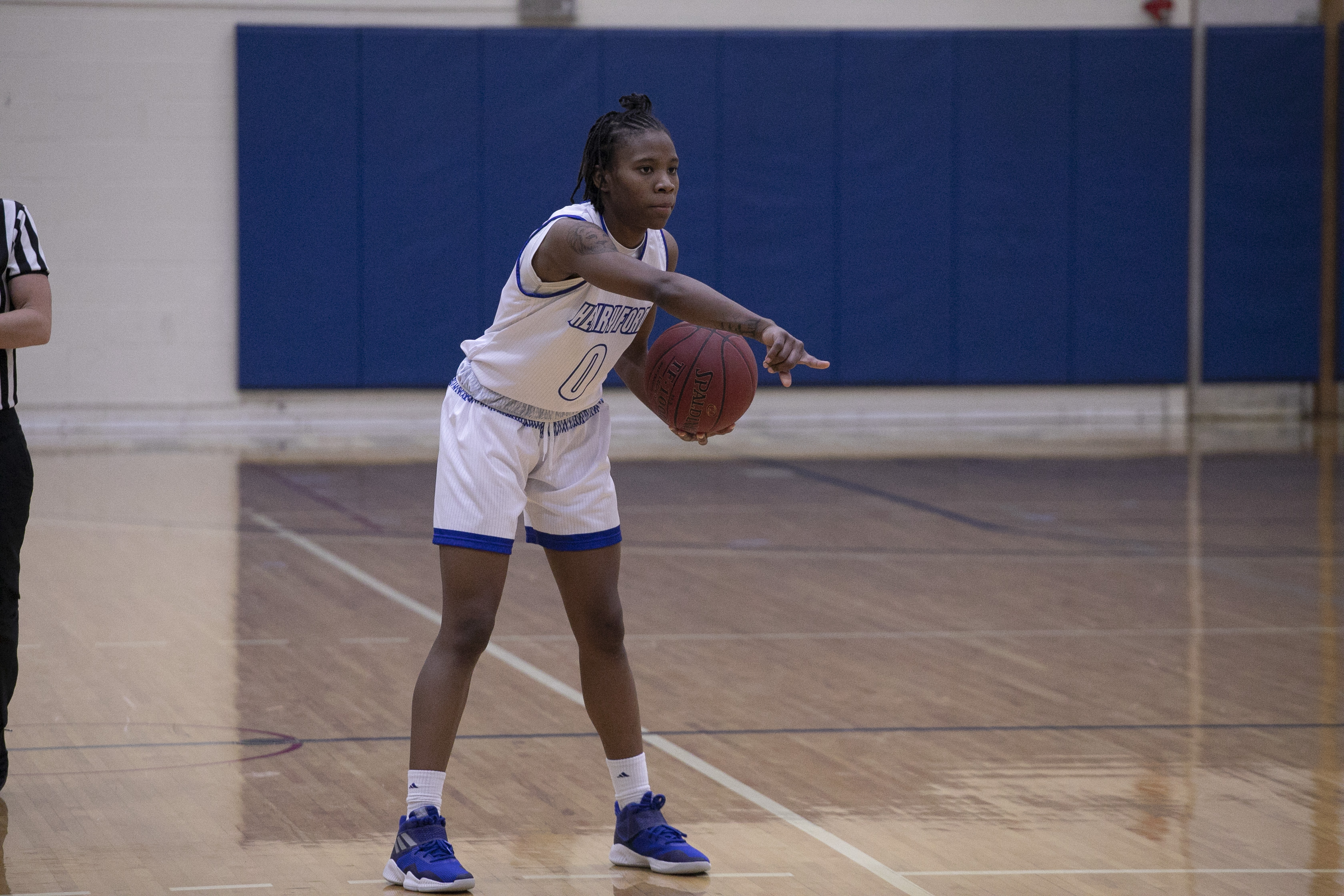 Basketball player Mariah Mitchell of Henry Ford College calling out a play