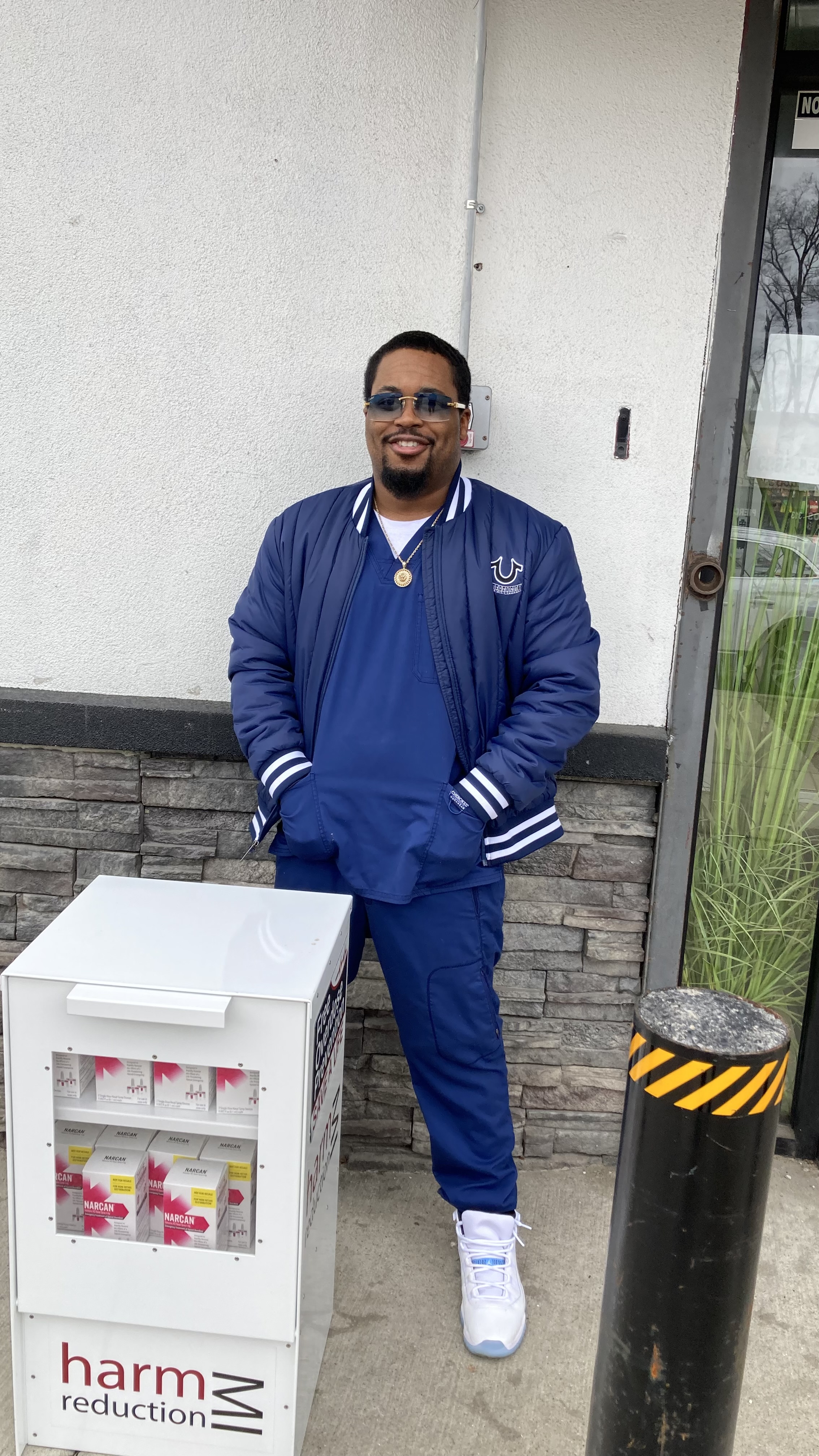 Charles Brooks, president of Phi Theta Kappa, standing behind Narcan dispansry at Henry Ford College, dearborn MI Charles Brooks, president of Phi Theta Kappa, standing behind Narcan dispansry at Henry Ford College, dearborn MI