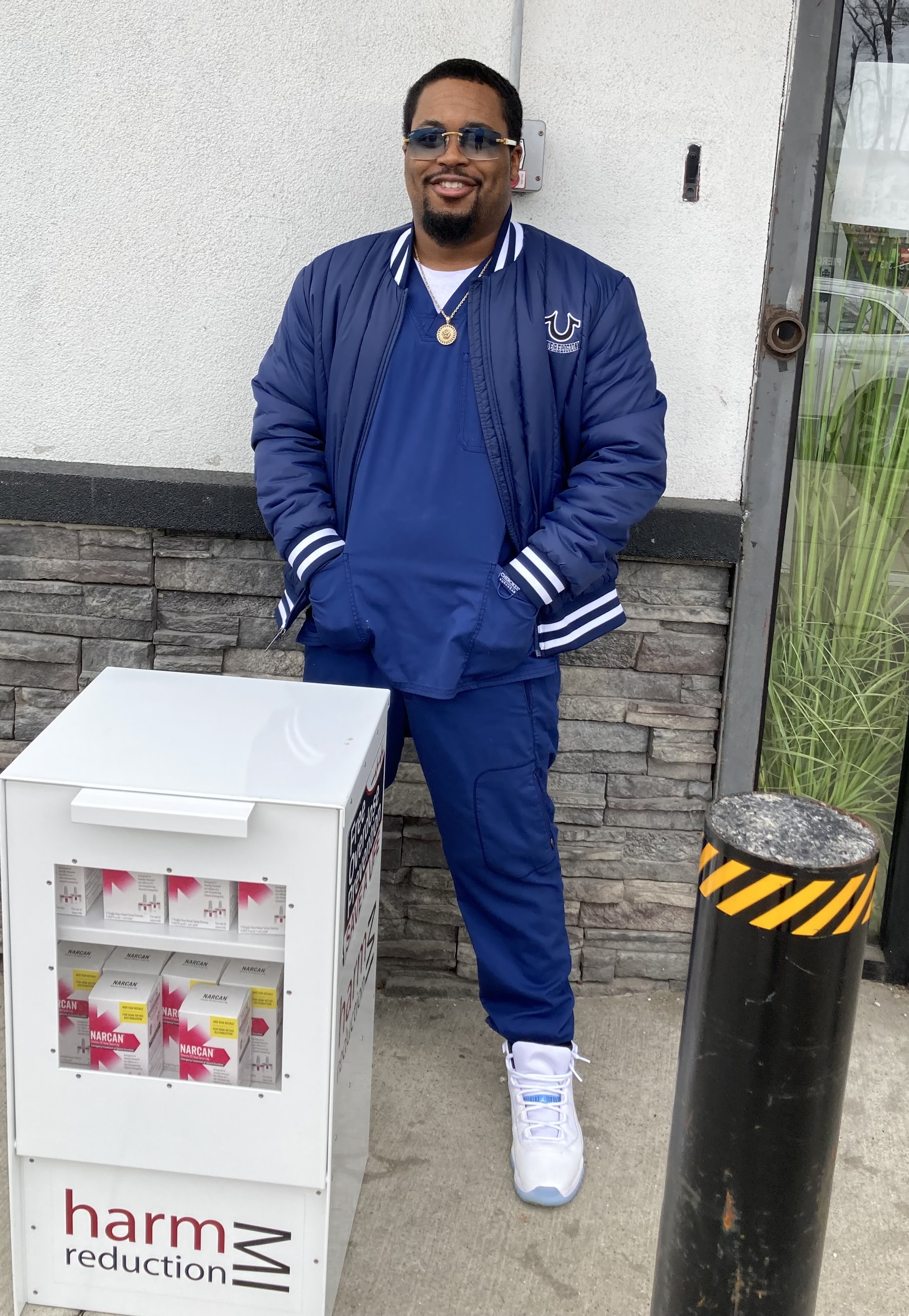 Charles Brooks, president of Phi Theta Kappa, standing behind Narcan dispansry at Henry Ford College, dearborn MI Charles Brooks, president of Phi Theta Kappa, standing behind Narcan dispansry at Henry Ford College, dearborn MI