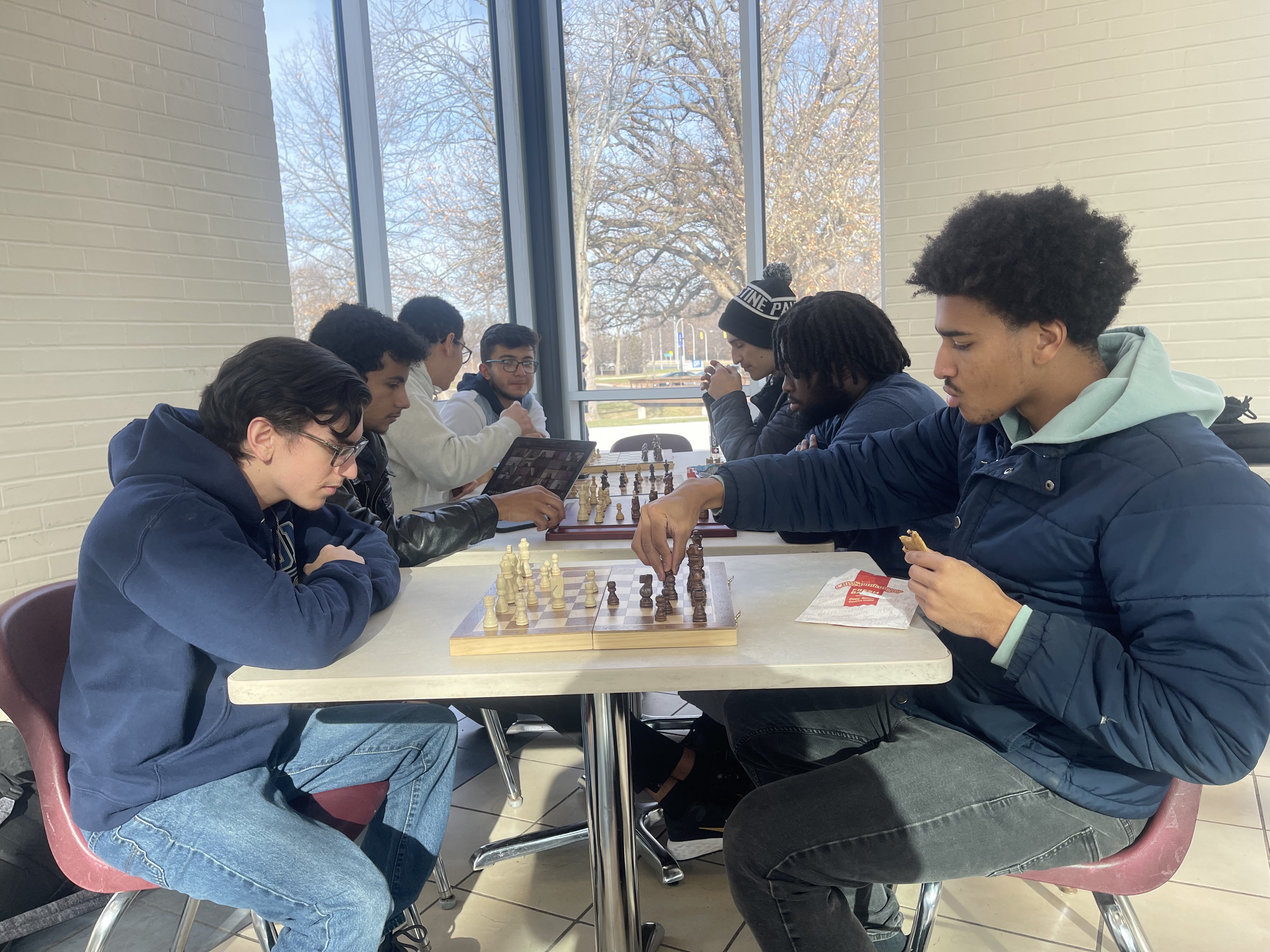 Henry Ford College Chess Club members in the Pavilion of the Student and Culinary Arts Center, Henry Ford College main campus, Dearborn, MI