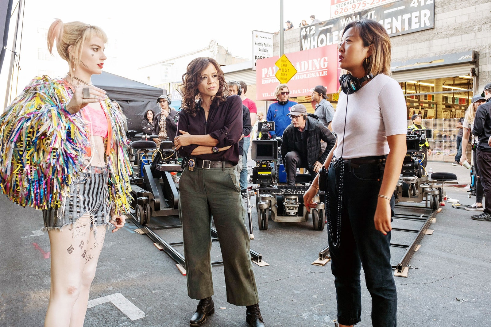 Image shows Margot Robbie, Rosie Perez and Cathy Yan on the set of "Birds of Prey"