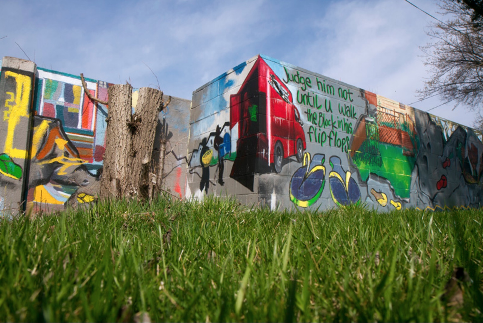 Mural on the historic Birwood Wall aka "8-Mile Wall." Photo courtesy Steve Neavling, Motor City Muckrakers Mural on the historic Birwood Wall aka "8-Mile Wall." Photo courtesy Steve Neavling, Motor City Muckrakers