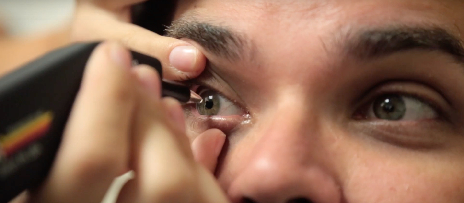 Image shows an eye being examined by an optometrist