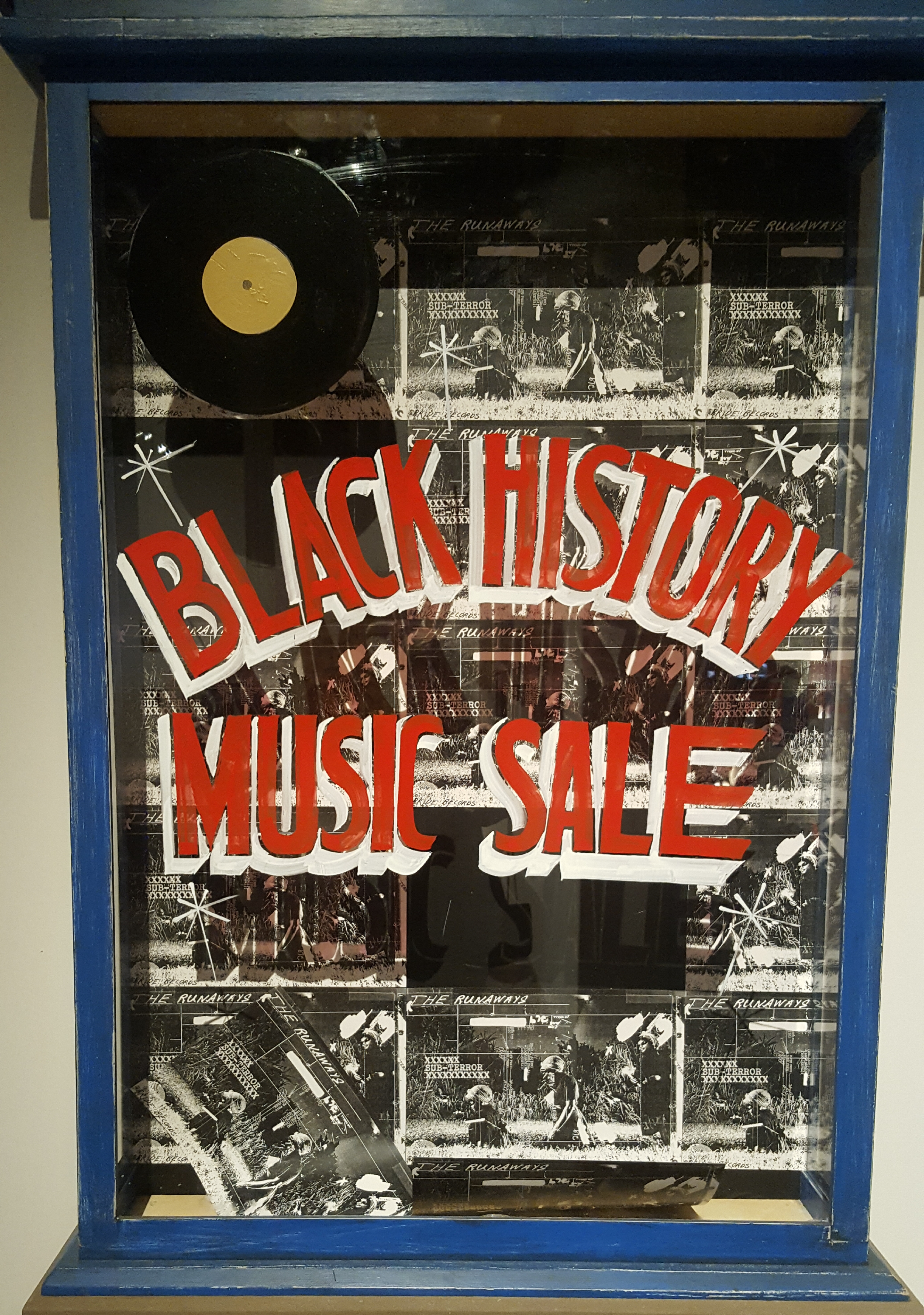 Jerry White’s Record Shop's window written on it  the Black History Music Sale