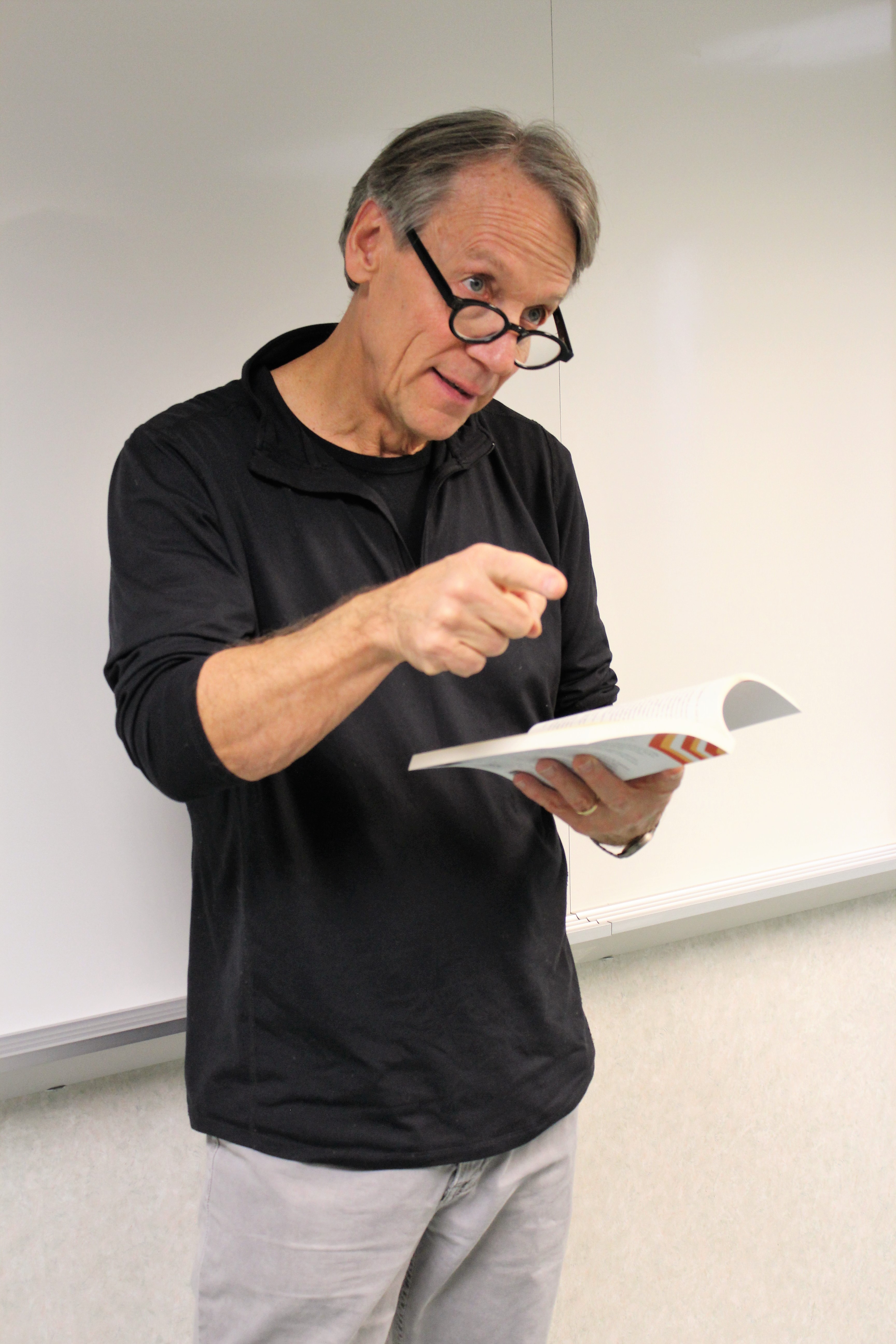 Photo of author Rick Bailey reading from his book Italian Chocolate American English