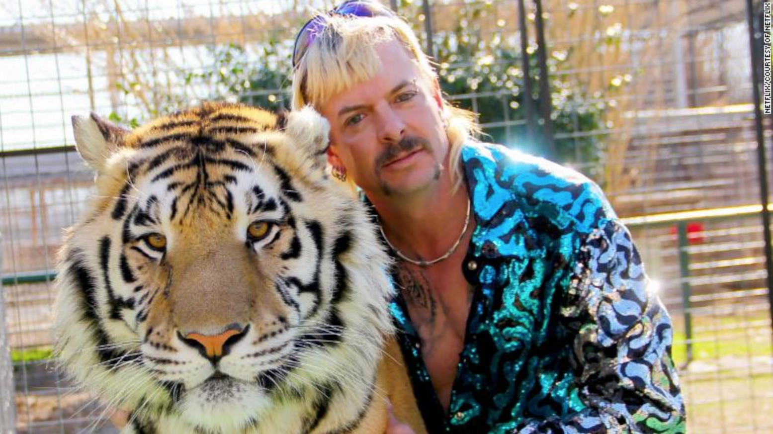 Image shows Joe Exotic of "Tiger King" with a tiger