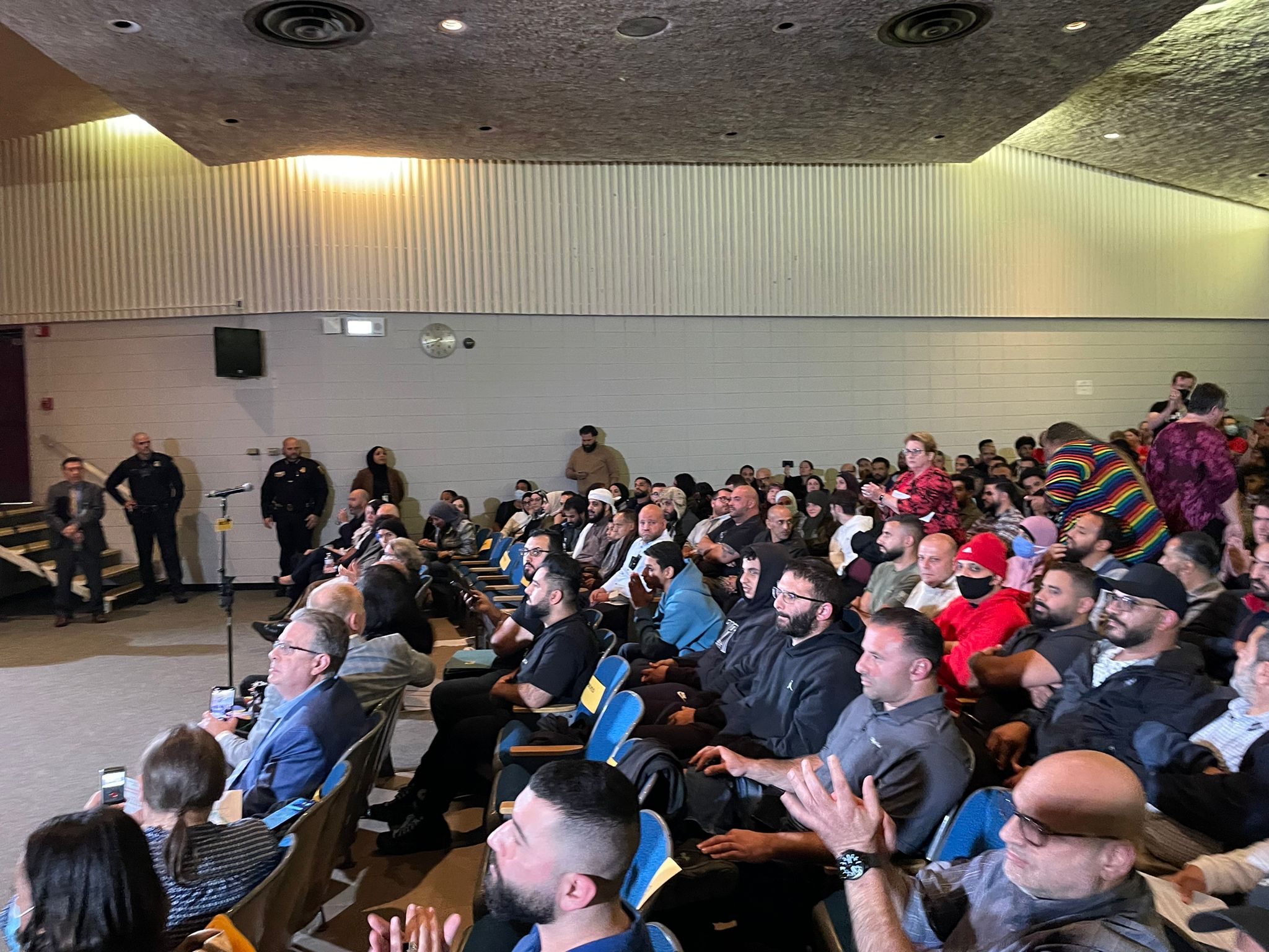 Parents crowded auditorium at Stout Middle School, Dearborn, MI for Dearborn Public Schools board meeting where parents expressed objections to LGBTQIA+ books in school libraries. Oct. 13, 2022. Photo by Kassem Doghman