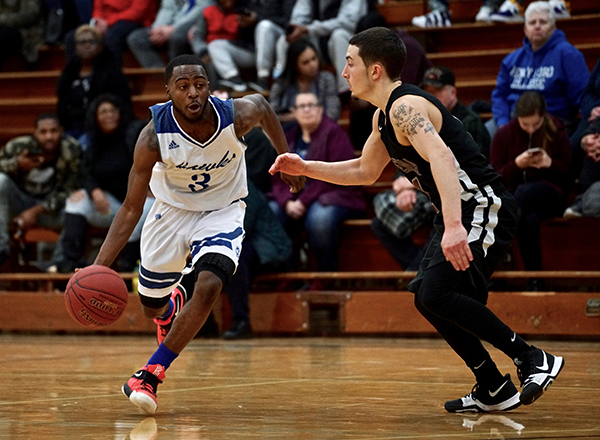 Photo of two men playing basketball