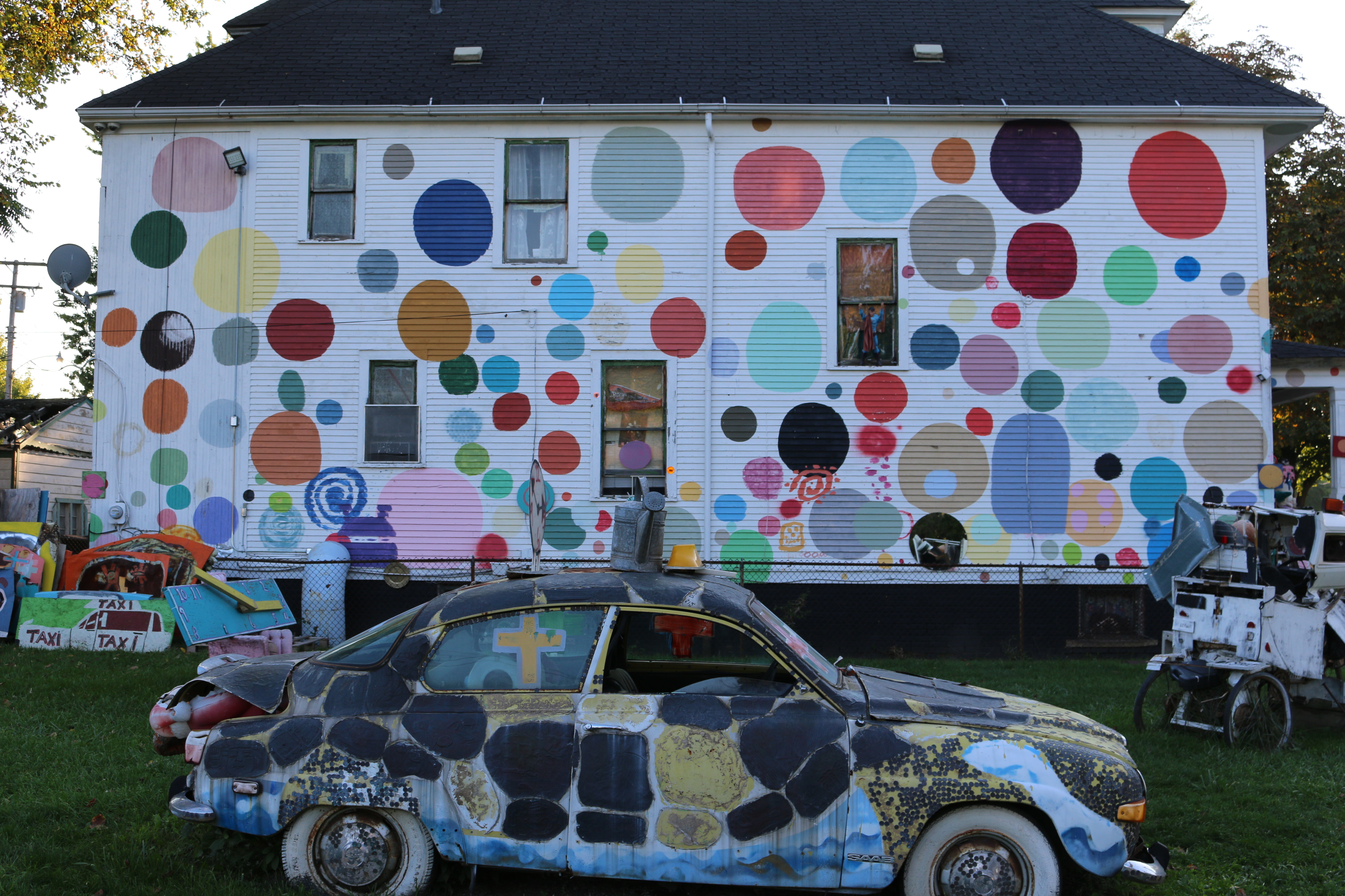 Dotty Wotty house with multi-colored polka dots on white painted exterior.