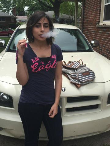 Dina Alzumut using an e-cigarette