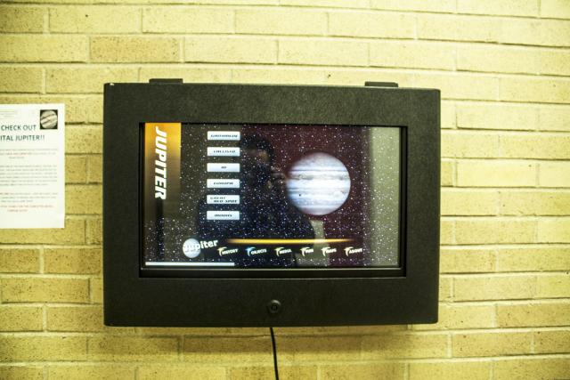 A screen displays the planet Jupiter and shows the planet and several options for details about the planet.