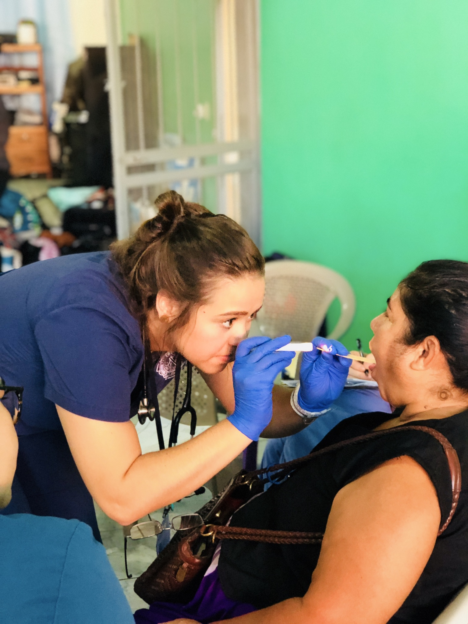 A nurse checking on a women from Costa Rica