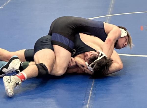 Henry Ford College Hawks’ wrestler, Alex Messing (FR), takes down and pins his opponent at the Adrian Invitational. Photo courtesy of Coach Grant Mackenzie.
