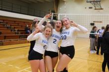 Photograph of three HFC Volleyball players: Hannah Sullivan, Emily Schroeder, and Katelyn Pinkowski.