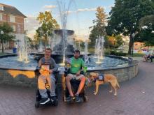 “Kevin Can” author Ian Flanagan and graphic illustrator Jesse Lindlbauer at the fountain in Kellogg Park, downtown Plymouth, Michigan. Photo by Toria Legris.