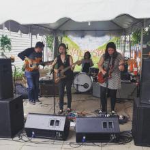 Three musicians playing the guitar for Seraphine Collective “Child Sleep” at BFF Fest 4  