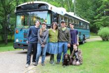 Photo of the Welch family standing in front of the bus home