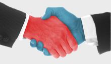 Red hand shaking blue hand representing Republican and Democrat