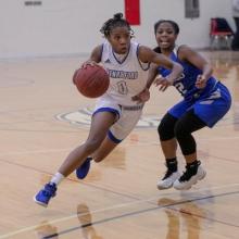 Guard Mariah Mitchell gets around WCCD Defender