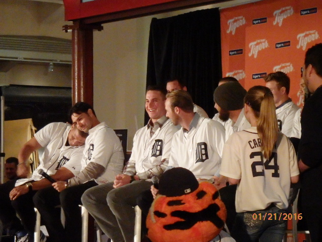 Several Tiger players sit on stage